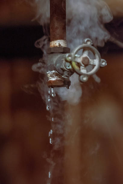 istock Broken valves leaking water and vapor 1461293824