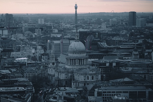 Aerial view of London skyline with St Paul Cathedral on a cloudy day.