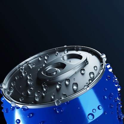 A closeup shot of a blue can with water drops on it on the black background