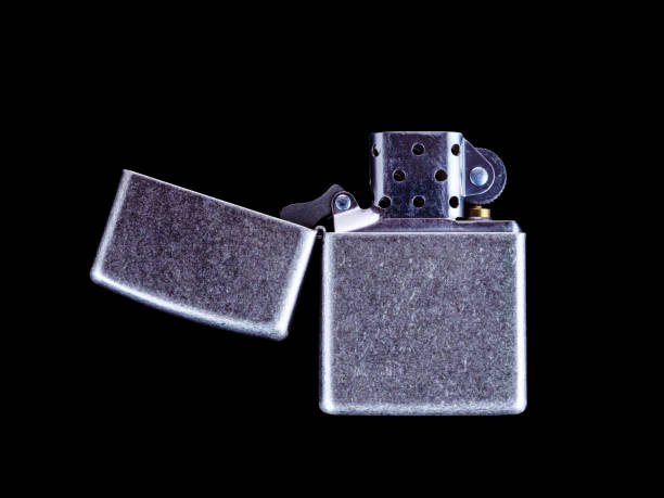 lighter with flame on dark background