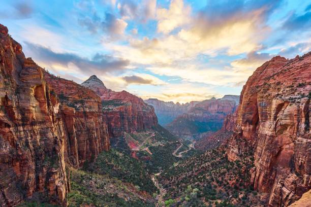 Landscape of Capitol Reef National Park in Utah, USA under colorful cloudy sky A landscape of Capitol Reef National Park in Utah, USA under colorful cloudy sky capitol reef national park stock pictures, royalty-free photos & images