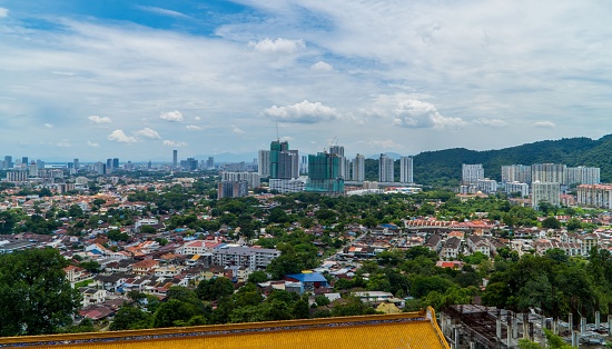 George Town, Malaysia – September 05, 2022: An aerial view of George Town, Malaysia, from Kek Lok Si Temple in blue sky background