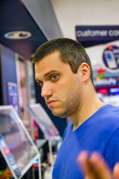 istock young man at the till checkout 1461299262