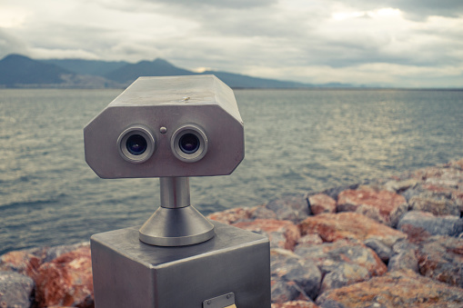 View of a public binocular in seaside.