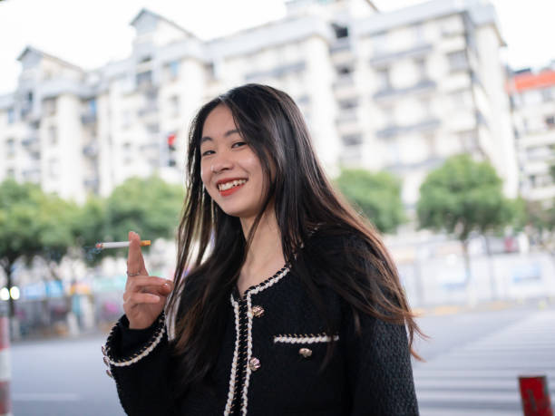 istock young woman smoking 1461302344
