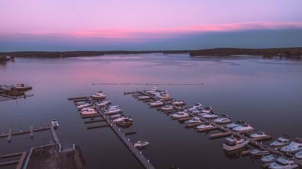 Aerial view view of the Northwind harbor located in Sodus Point New York seen during sunset An aerial view view of the Northwind harbor located in Sodus Point New York seen during sunset rochester new york state stock pictures, royalty-free photos & images