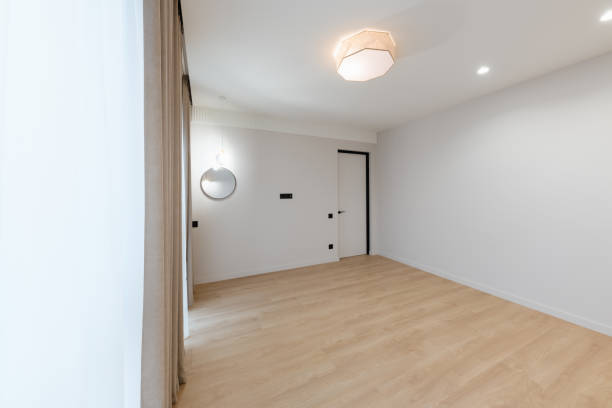 istock clean large bright room with white walls and lighting 1461307022