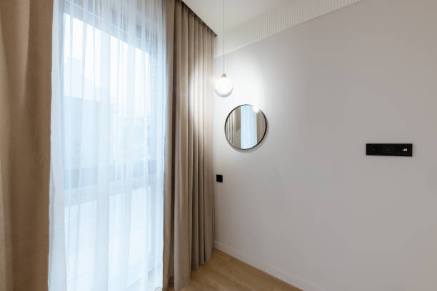 istock clean large bright room with white walls and lighting 1461307025