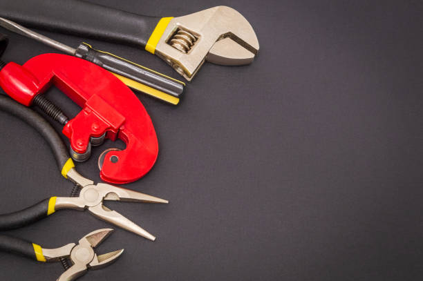 istock Big set of tools on black background prepared by the master before repair or construction 1461309454