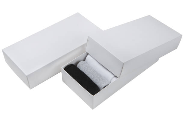 istock Two gift sets of socks in white boxes, one box is partially open, on a white background 1461314731