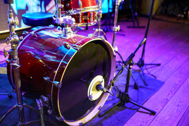 istock drum kit. set of drums, cymbals and other percussion instruments on stage 1461318394