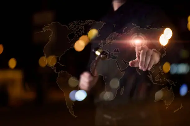 Photo of The lawyer clicks on a location point on the world map .