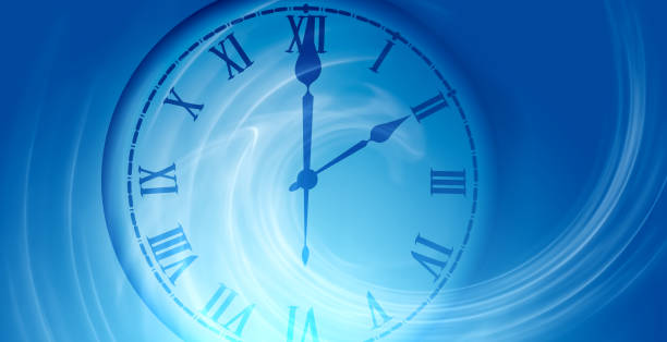 istock image of a clock face on a blurred blue abstract background 1461325074
