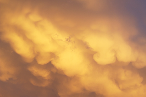 Dramatic stormy cloudscape on the sky with sunset light . Spring special background.