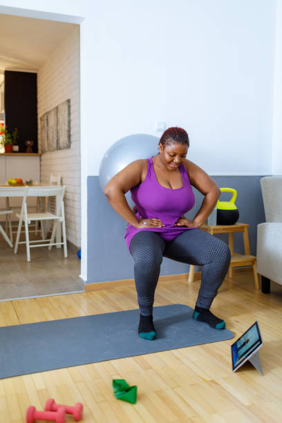 istock Woman Doing Squatting With Exercise Ball 1461327361