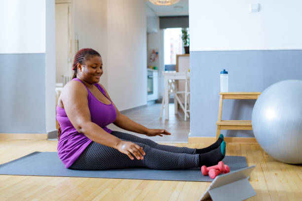 istock Young African Woman Exercising At Home 1461328179