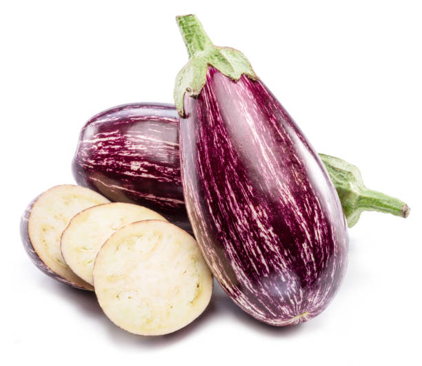 istock Fresh striped aubergines or eggplants with leaf and slices isolated on white background. 1461328307