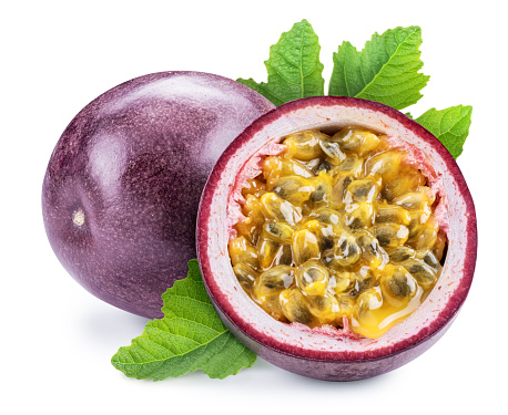 Purple passion fruit and half of it with yellow seedy flesh. Isolated on white background.