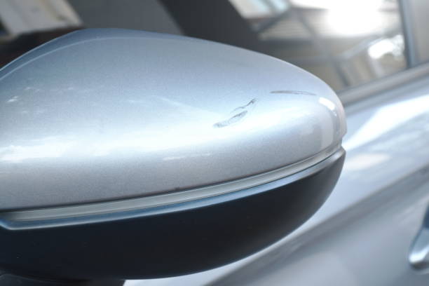 istock scratch from accident on silver color car side view mirror background and texture 1461330439