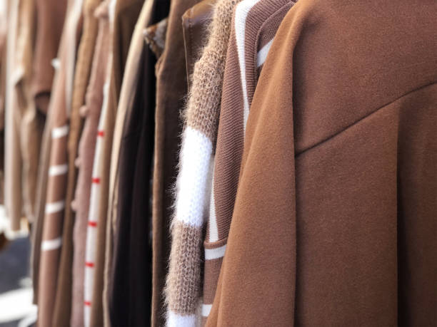 istock Brown clothes hanging in second hand store 1461332534
