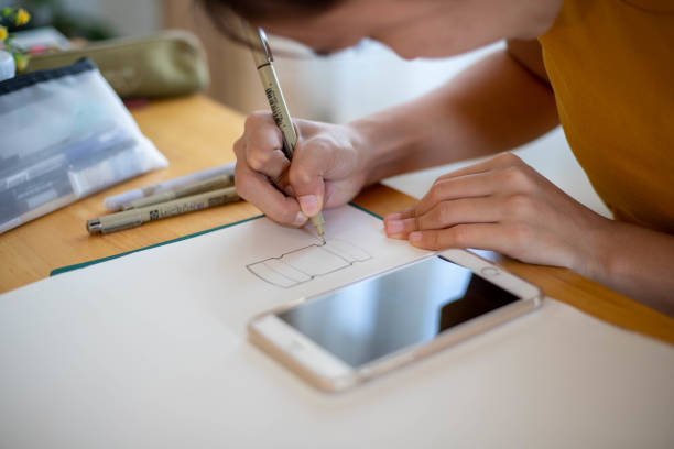 istock Woman's hand drawing a picture on the phone 1461339321