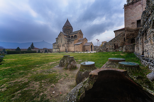 Wide angle view from winesellar to Svetitskhoveli Cathedral in Mtskheta in winter. Georgia