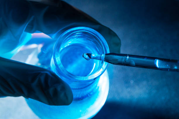 istock blue science test tube,Microscope with laboratory glassware Research and development concepts in science labs. 1461339618