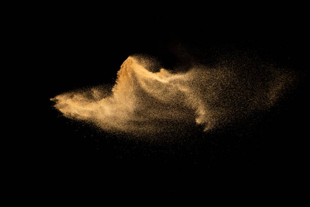istock Dry river sand explosion.Brown color sand splash against black background. 1461340515