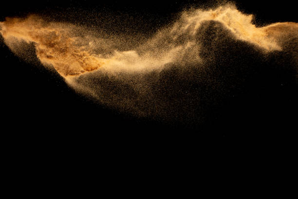 istock Dry river sand explosion.Brown color sand splash against black background. 1461340532