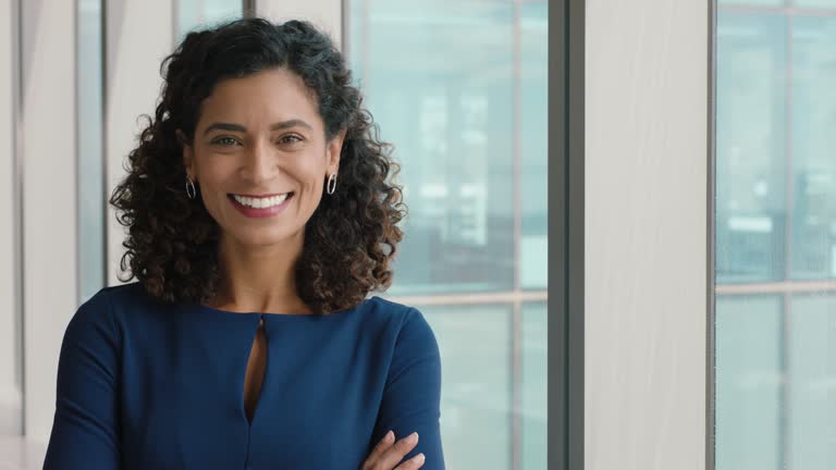 portrait confident business woman smiling with arms crossed successful female office executive enjoying career in corporate leadership company manager at work