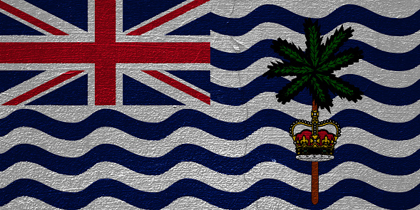 Flag of the British Overseas Territory of British Indian Ocean Territory on a textured background. Concept collage.