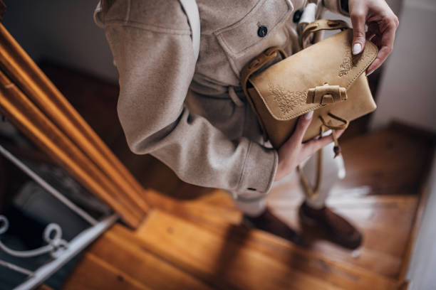 Unrecognizable fashionable woman holding a modern purse.