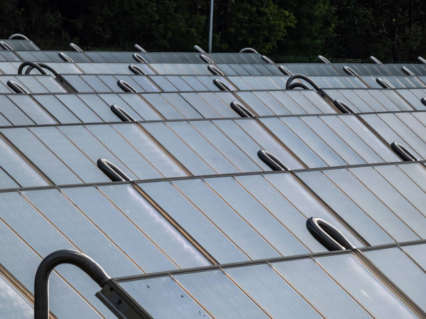 istock PV solar panels from solar field providing alternative green energy used for heating. Solar thermal collectors generating electricity, use of renewable energy 1461342942