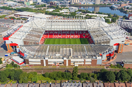 Houston, United States - April 13, 2023:  Aerial view of both the NRG Stadium, home to the NFL's Houston Texans, and the historic Astrodome, the first indoor sports arena, now listed as a historic site shot from an altitude of about 600 feet overhead during a helicopter photo flight.