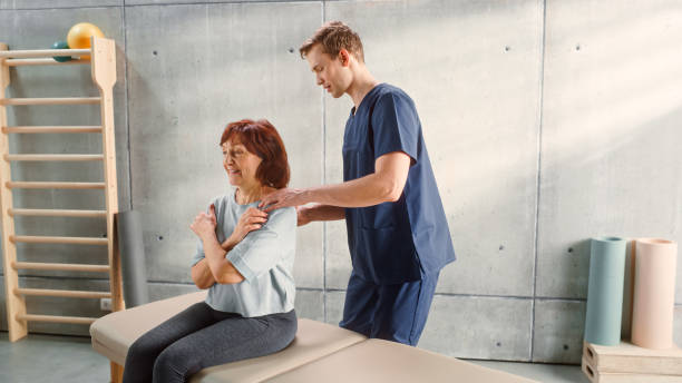 istock Advanced Sport Physiotherapy Specialist Stretching and Working on Specific Muscle Groups or Joints with Elderly Woman. MIddle Aged Female Treating Her Mild Injury or Undergoing Rehabilitation. 1461351938