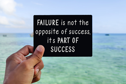 Failure is not the opposite of success, it's part of success. Text on card with sea background. Inspirational motivational quote.