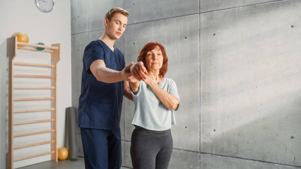 istock Professional Sport Physiotherapist Working on Specific Muscle Groups and Back Pain with Middle Aged Sporty Female. Senior Woman Treating Mild Injury. Trauma Prevention Therapy, Rehabilitation. 1461352501