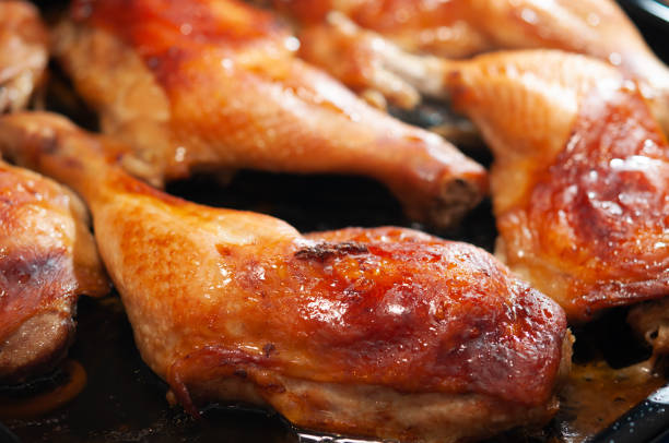 istock Nicely grilled chicken leg meat in the oven. 1461352673