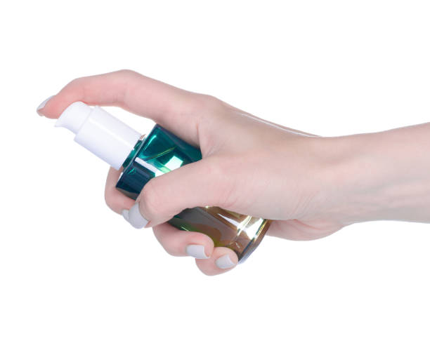 istock Cosmetic bottle with dispense in hand 1461354664