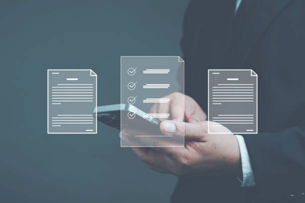 istock electronic document management paperless workplace electronic signature electronic signature Document worker signing electronic documents on digital documents with virtual mobile screen using finger 1461354921
