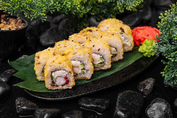 Warm sushi rolls with tempura shrimp stock photo