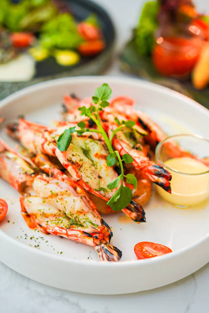 istock Grilled shrimp and sauce in a white plate 1461356382