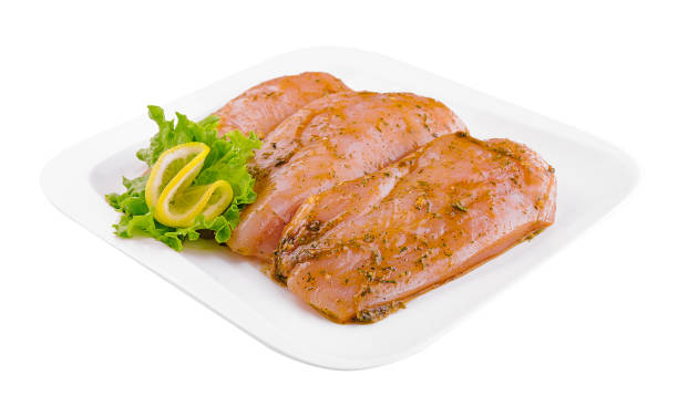 istock Raw marinated chicken fillet on plate 1461356387