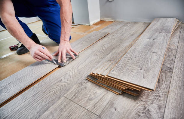 istock Male worker hands drawing line on laminate wood plank. 1461358343