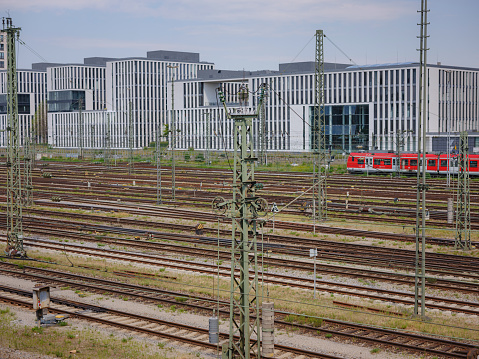 Munich, Germany - August 4, 2022 : Train line crossing near central trail station. S-Bahn tracks. Electric rail transit system in Munich