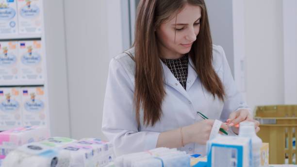 istock Pharmacist puts price tags on medicines packages 1461359127