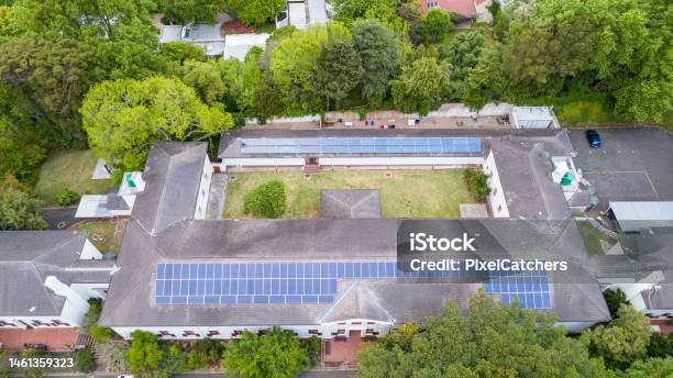 Large Old Rooftop With New Solar Panels From Above Stock Photo - Download Image Now - Aerial View, Apartment, Boarding School