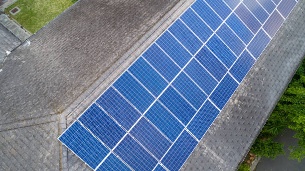 istock Solar panels in rows on pitched roof 1461359388