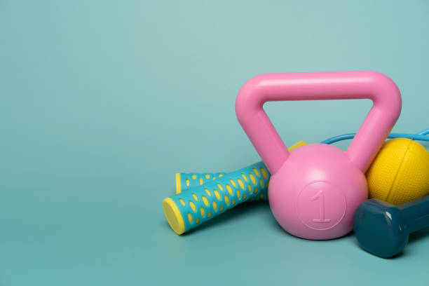istock close up exercising sport equipment with green table background 1461360235