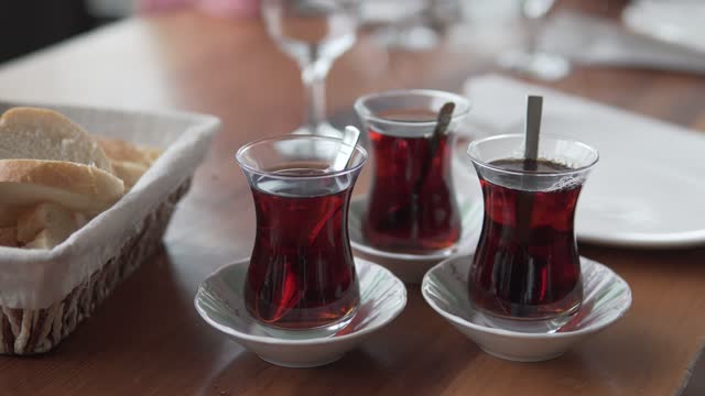 There is steam from hot Turkish tea, hot tea in glass cups